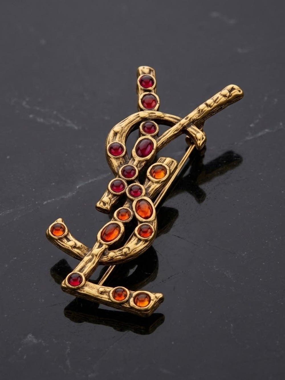 Gold-Tone Brooch with Red and Orange Gem Accents - Designer Style